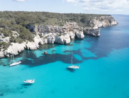 Turquoise water and cliffs at Cala Macarella