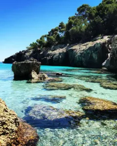 cala fustam beach menorca